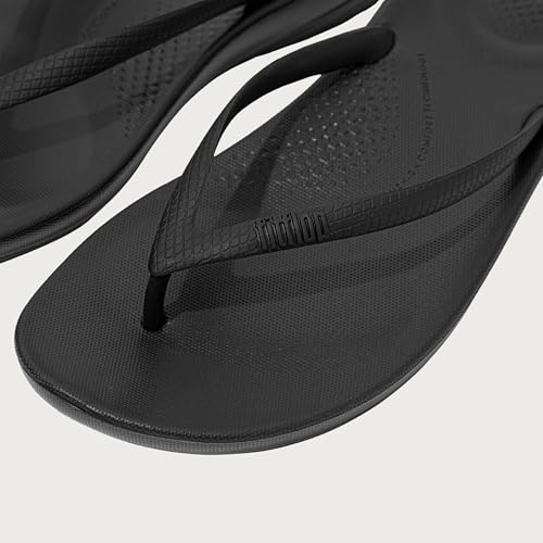 FitFlop Women's iQushion Rubber Flip-Flips with Contoured Footbed for Walking, Lightweight Ergonomic Flip Flop Sandals with Arch Support and Foot Impact Pillows, All Black, 6 US Women
